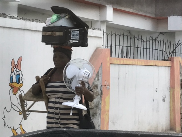 Haitian woman taking her wares to market.
