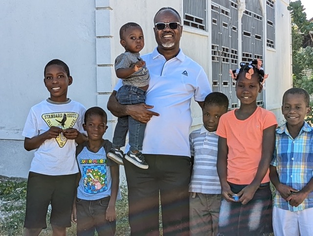 Living Water Christian Missions founder, Salonique Adolphe, with first group of orphans for new orphanage.
